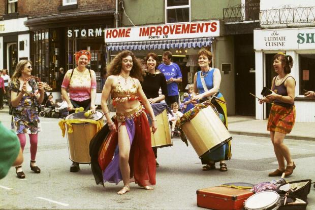 County Times: Newtown May Festival, Kay Davies dancing to the Samba band on the streets of Newtown.